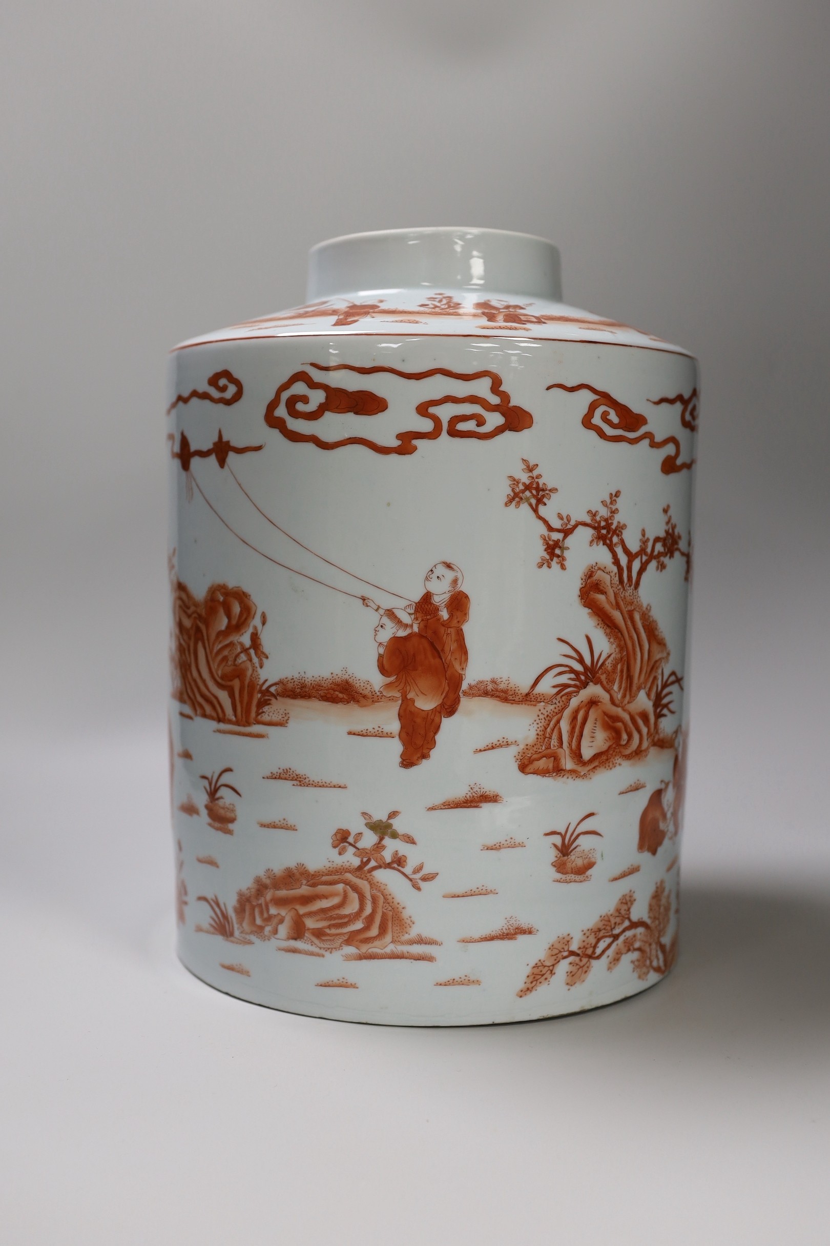 An early 20th century copper red enamelled canister. 30cm tall